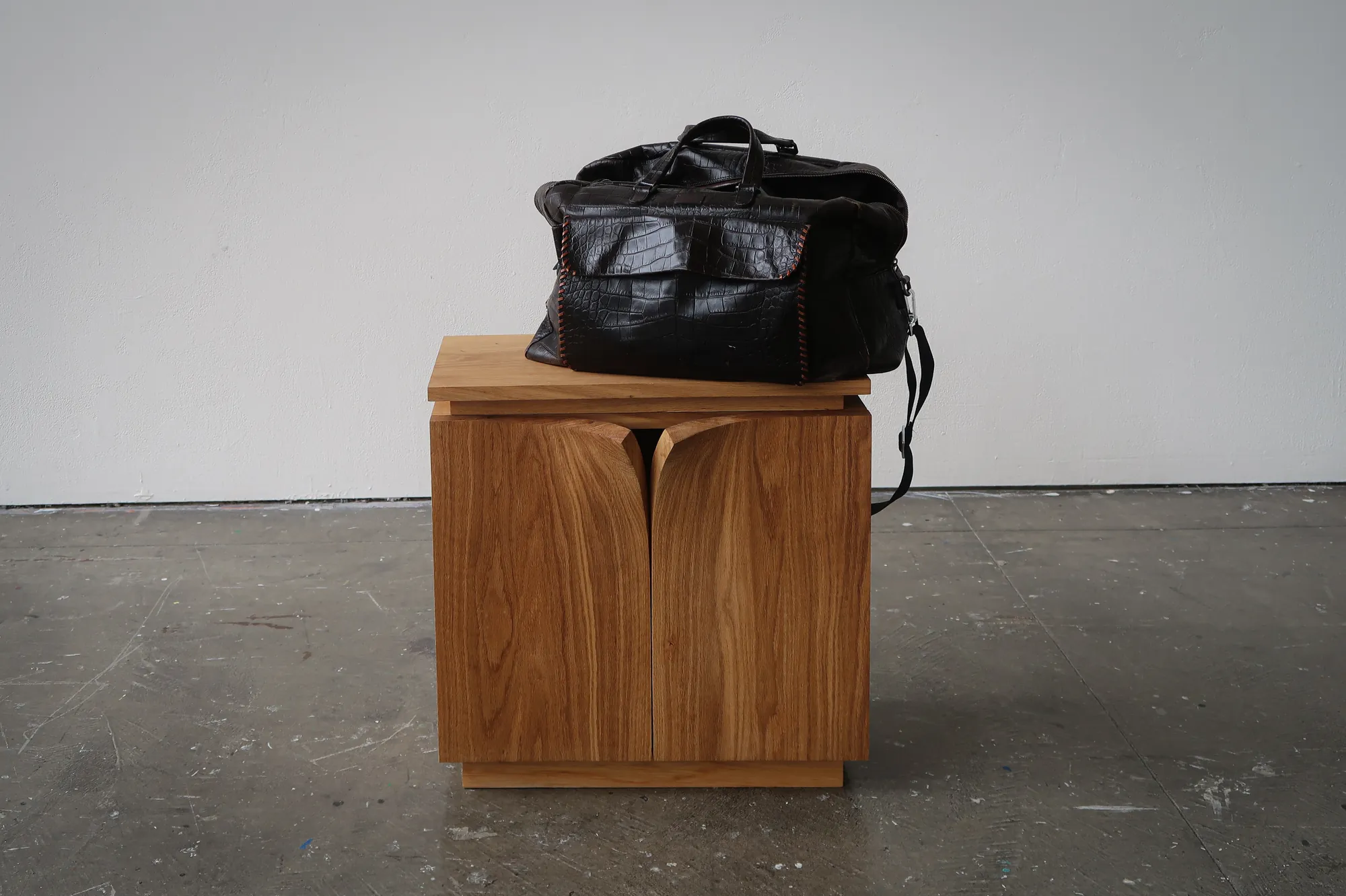 A bag resting on top of the cabinet