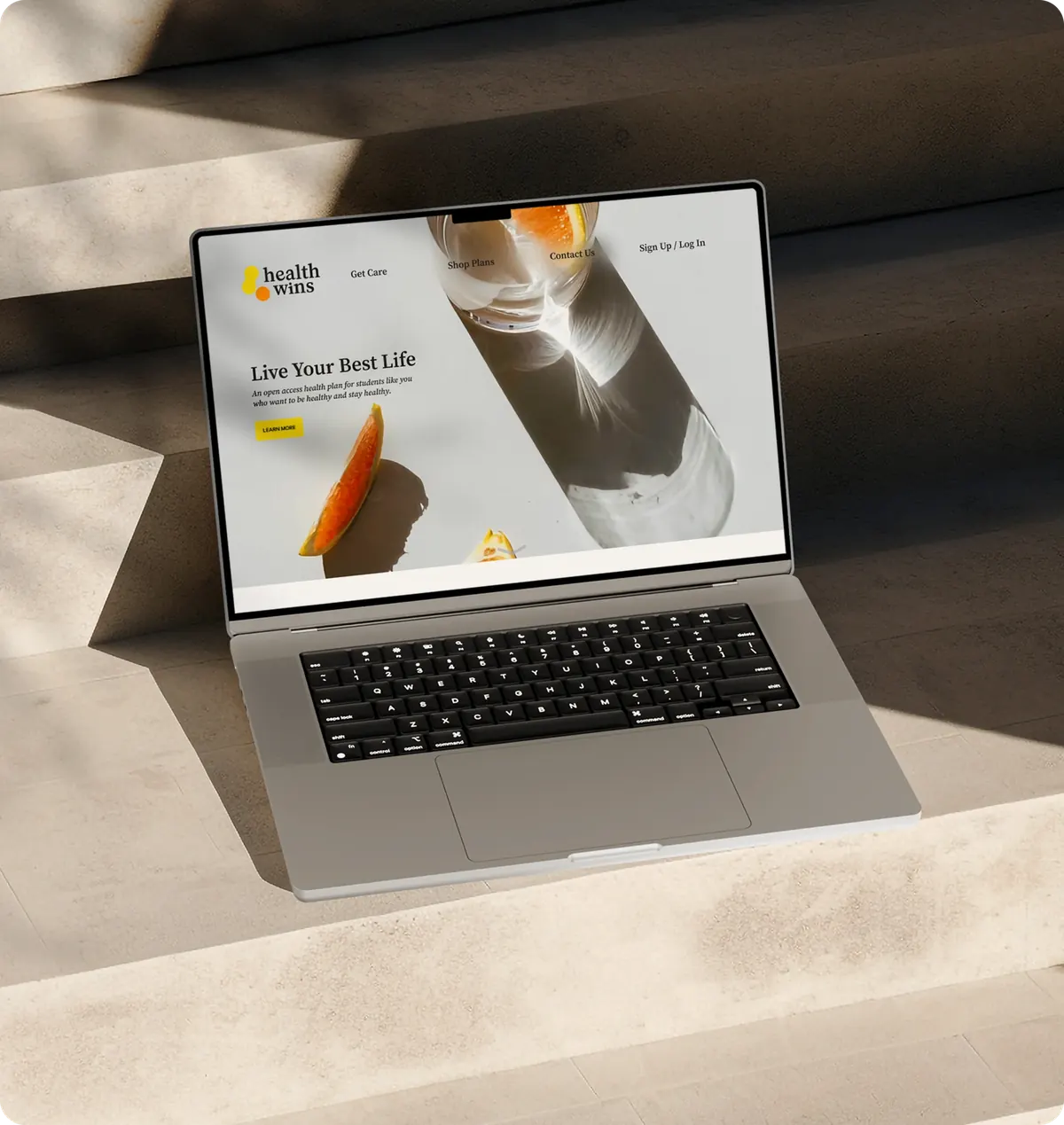 The Health Wins website on a laptop