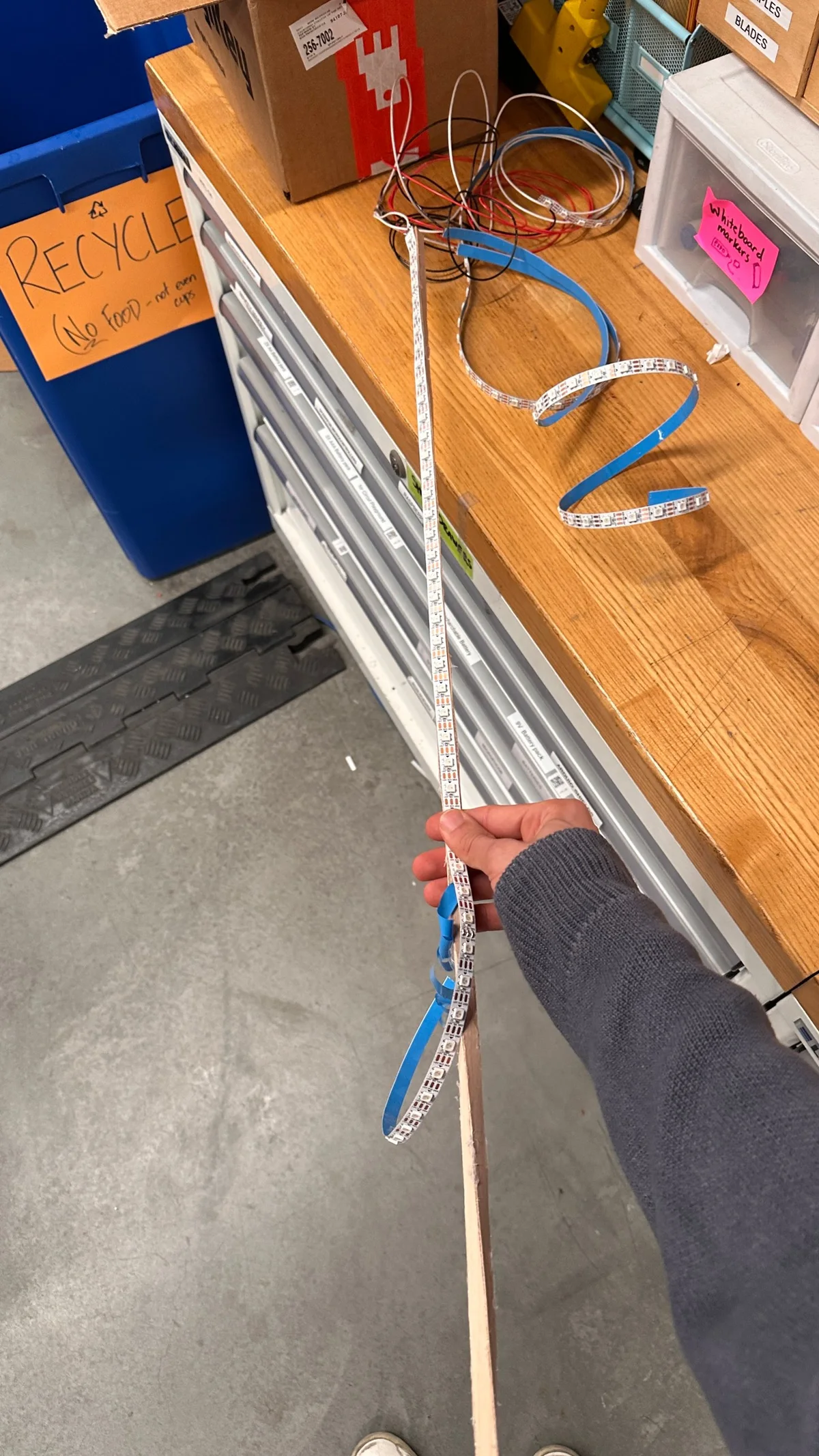 Measuring an LED strip against the length of a tube